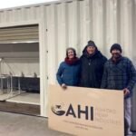 Photo: Connie (L) and Leon (R) with Andi Lucas (C) from X-Hemp, Tasmania taking ownership of his new Ashford Hemp Processor.